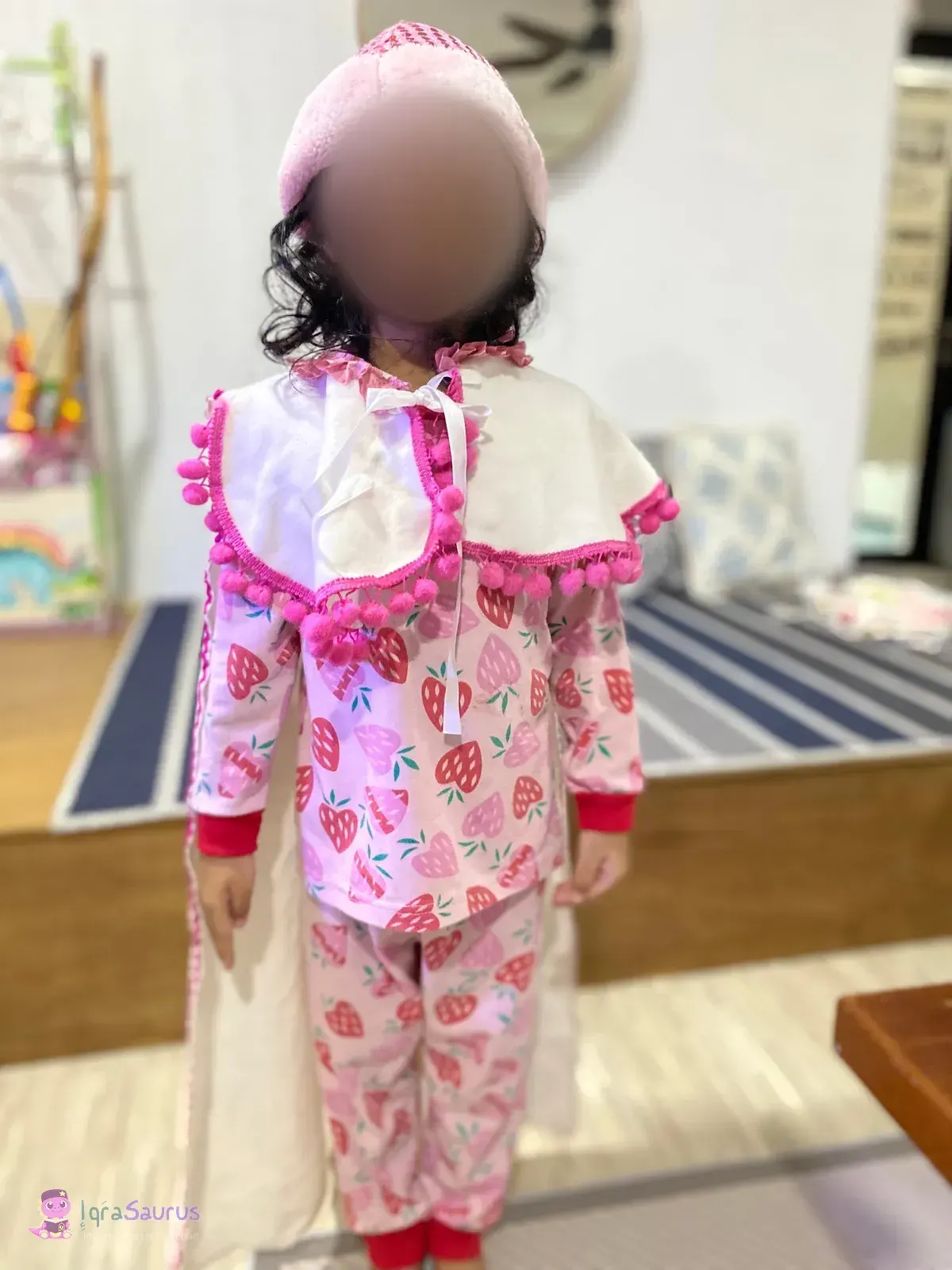 A girl in a dress-up costume and a knitted hat