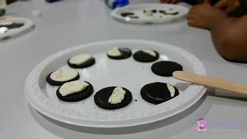 Biscuits on a plate with the cream scraped to show the phases of the moon