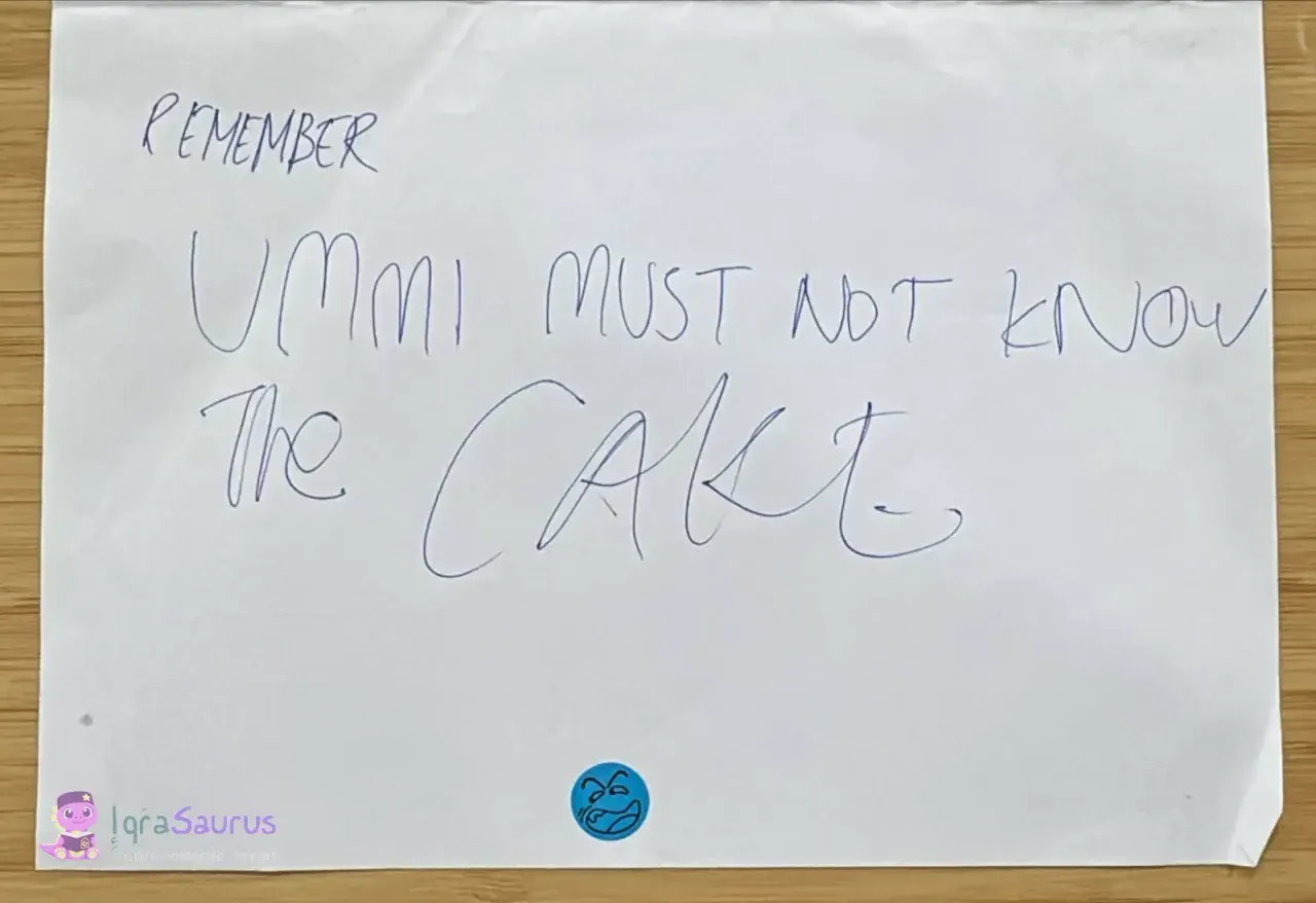 A sheet that reads "REMEMBER UMMI MUST NOT KNOW THE CAKE"