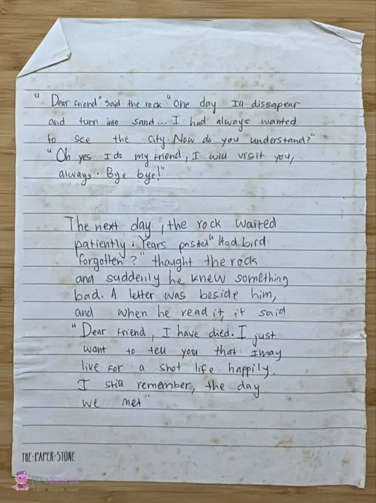 The second handwritten page of the story on lined notepaper, ending with the bird's letter.